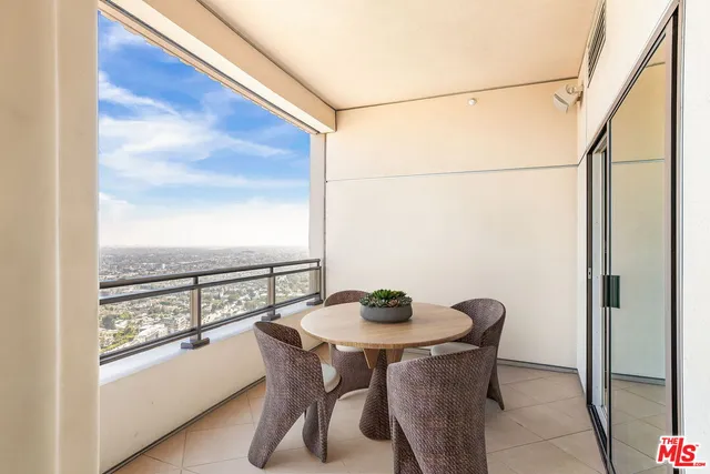 a view of a dining room with furniture and window