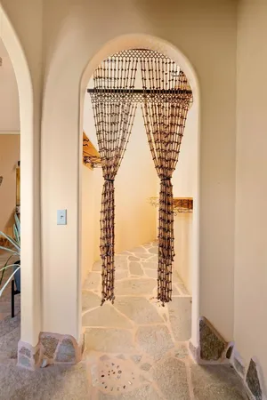 a view of a living room and entry way