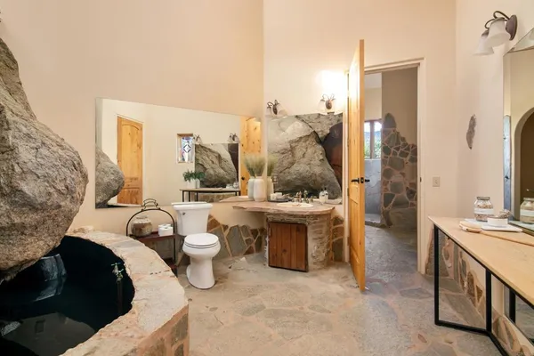 a bathroom with a toilet sink and shower