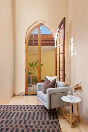 a spacious bathroom with a tub sink and mirror