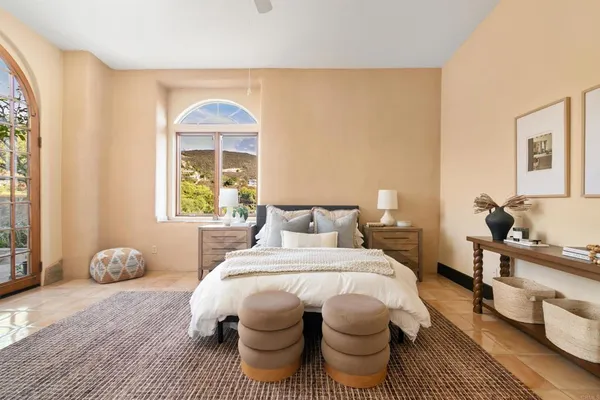 a bedroom with a bed and a couch