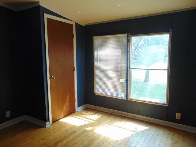 a view of an empty room and window
