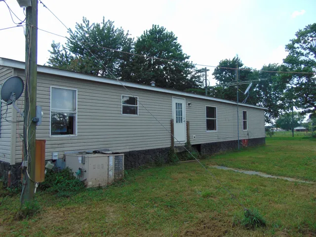 a house view with a backyard space