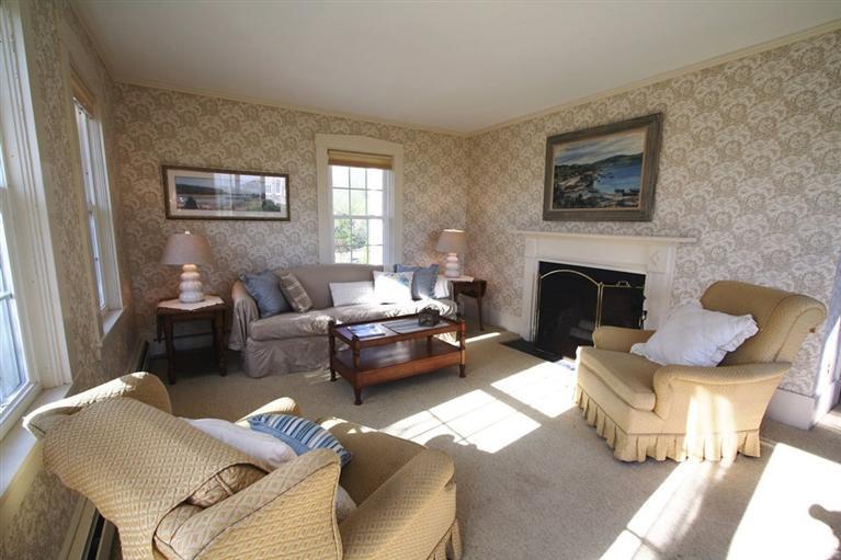 69 Champlain Road Chatham, MA 02633 - Photo 6 of 21 a living room with furniture and a fireplace