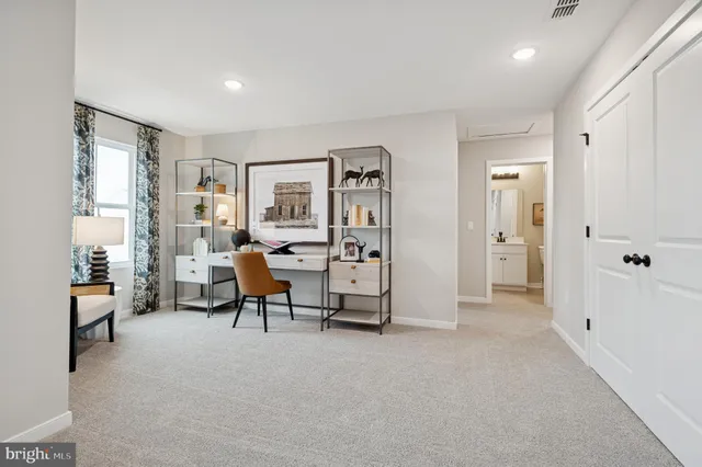 a view of a livingroom with furniture and a flat screen tv
