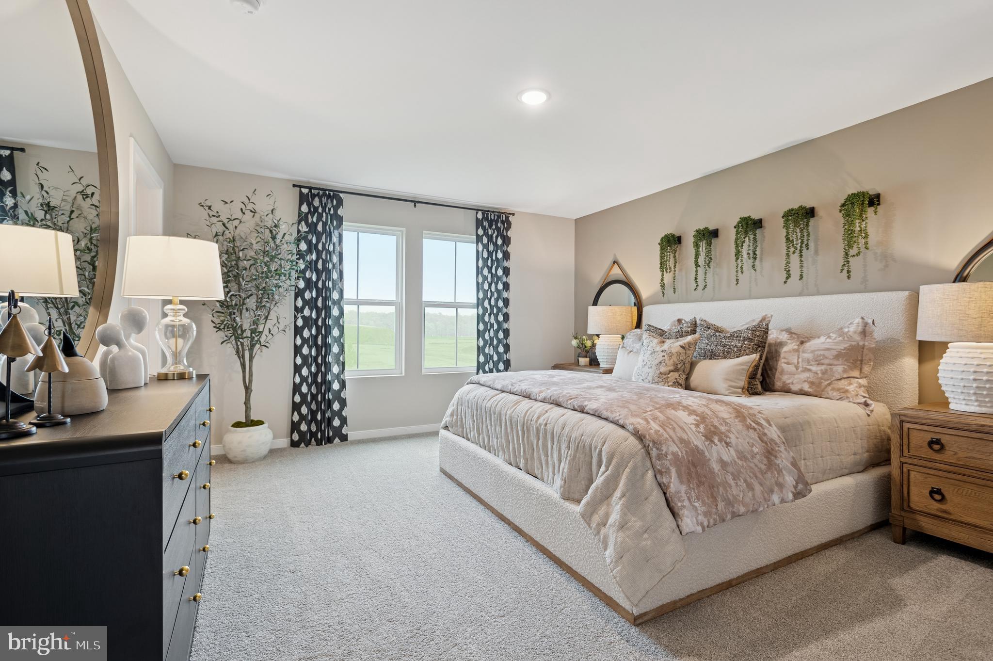 27 Butternut Drive, Unit 14 Berlin, NJ 08009 - Photo 32 of 38 a spacious bedroom with a large bed and a table