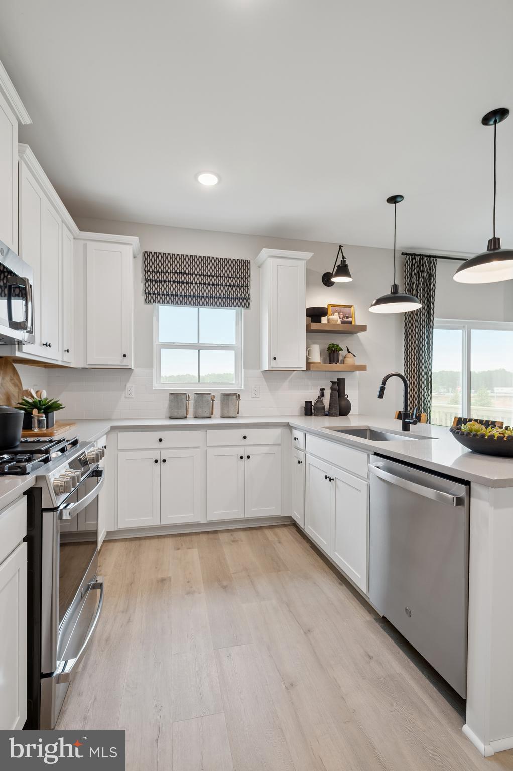 27 Butternut Drive, Unit 14 Berlin, NJ 08009 - Photo 10 of 38 a large white kitchen with cabinets