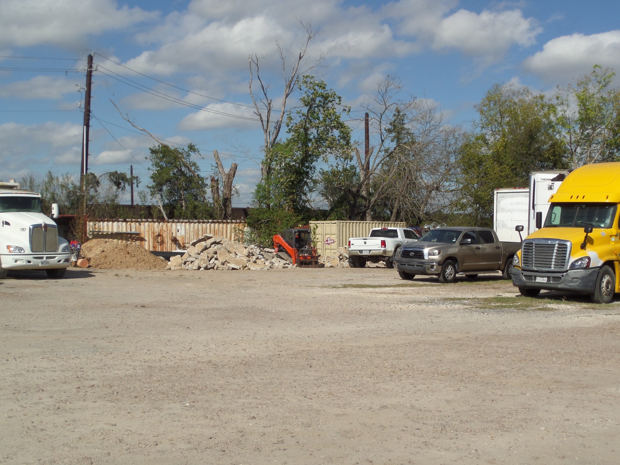 9700 Mykawa Road Houston, TX 77048 - Photo 13 of 48 a view of road with card parked on side and retail shops