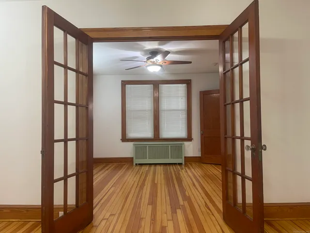 a view of entryway with wooden floor