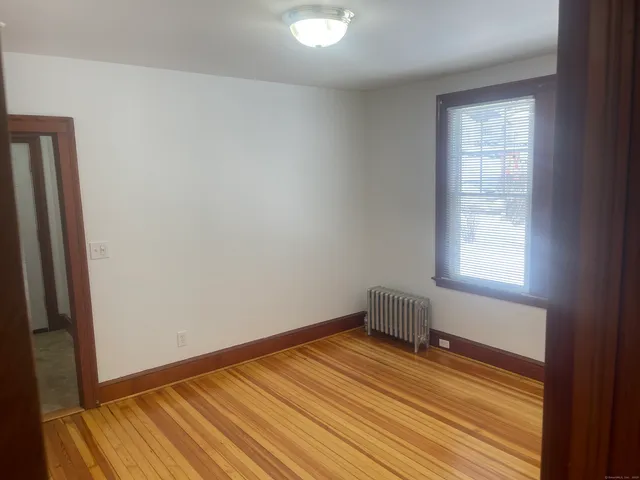 a room with a bed and a window