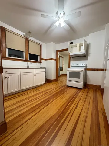 a kitchen with stainless steel appliances a stove top oven and sink