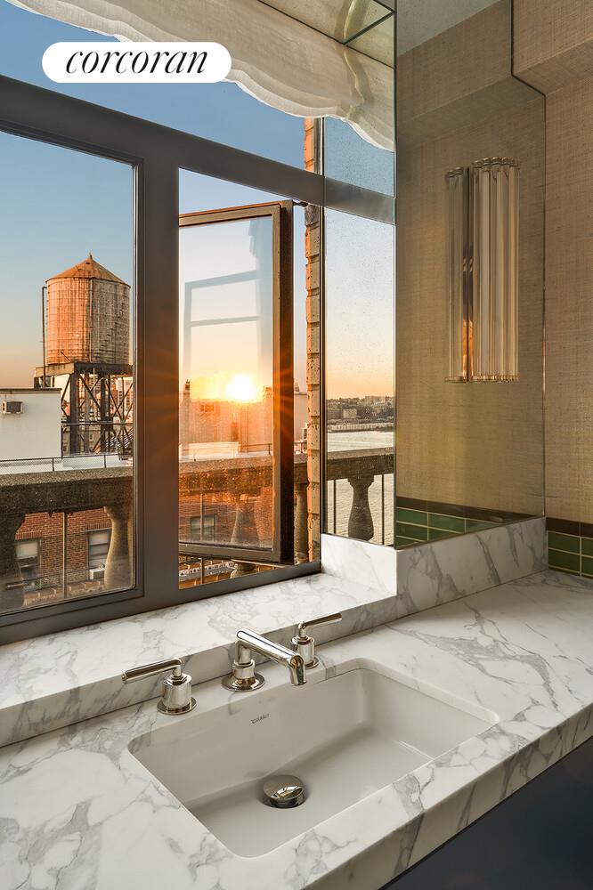 140 Riverside Drive, Unit 19HO Manhattan, NY 10024 - Photo 13 of 35 a room with a table and large windows