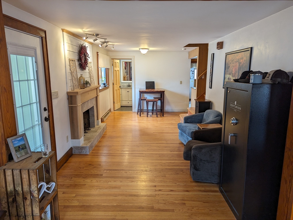 125 Plumtree Road Sunderland, MA 01375 - Photo 11 of 41 a living room with furniture and a flat screen tv