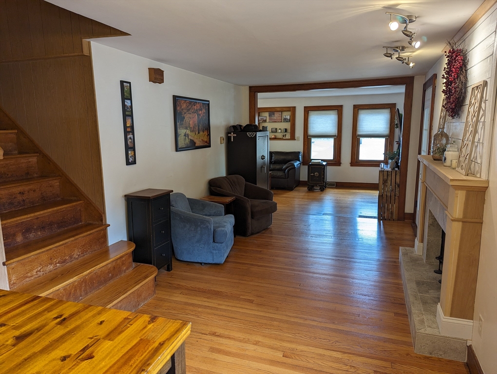 125 Plumtree Road Sunderland, MA 01375 - Photo 12 of 41 a living room with furniture and a wooden floor