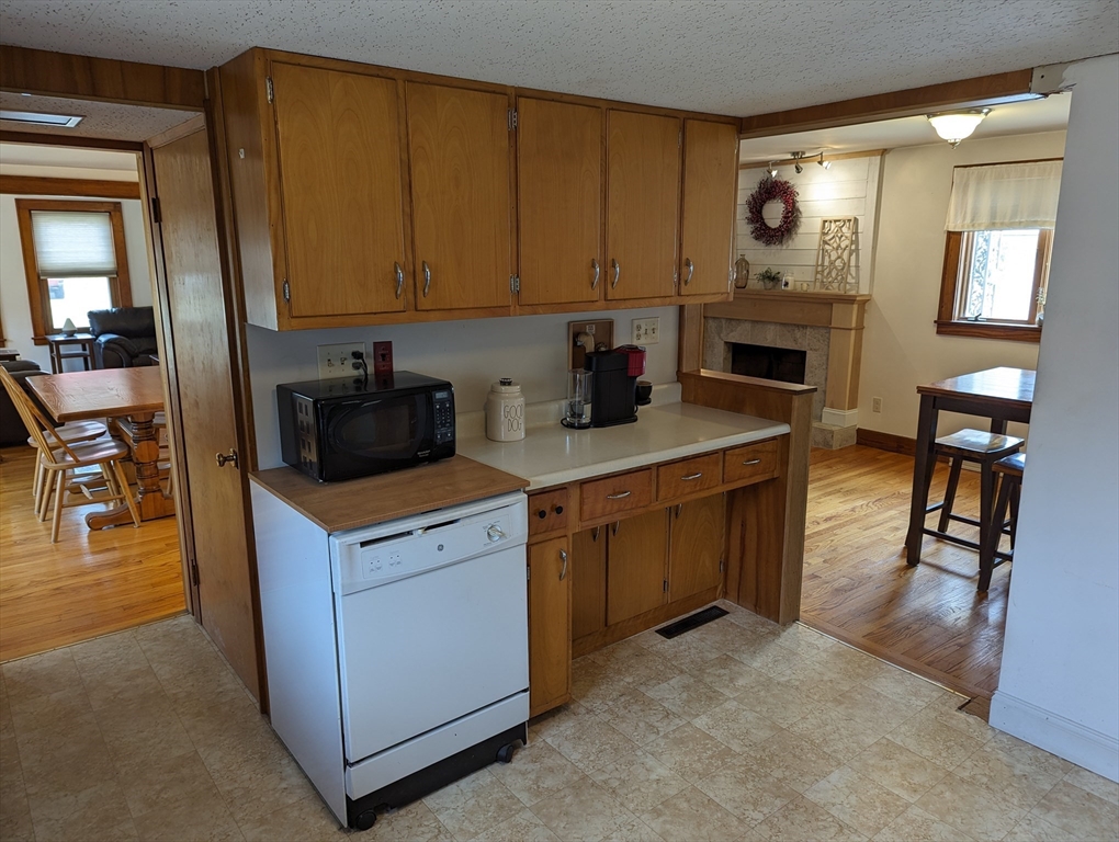 125 Plumtree Road Sunderland, MA 01375 - Photo 18 of 41 a kitchen with a stove a sink and a microwave