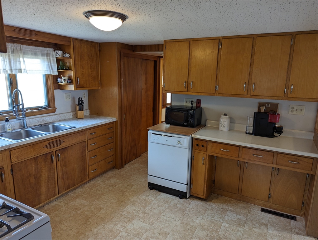 125 Plumtree Road Sunderland, MA 01375 - Photo 19 of 41 a kitchen with sink cabinets and window