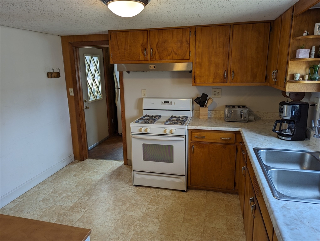 125 Plumtree Road Sunderland, MA 01375 - Photo 20 of 41 a kitchen with a stove cabinets and a sink
