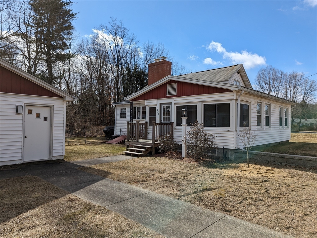 125 Plumtree Road Sunderland, MA 01375 - Photo 2 of 41 a view of a white house with a large tree in front of it