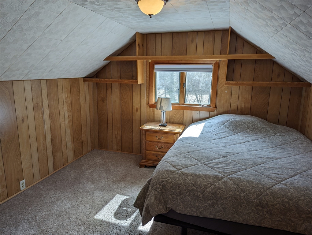 125 Plumtree Road Sunderland, MA 01375 - Photo 25 of 41 a bedroom with a bed and wooden floor