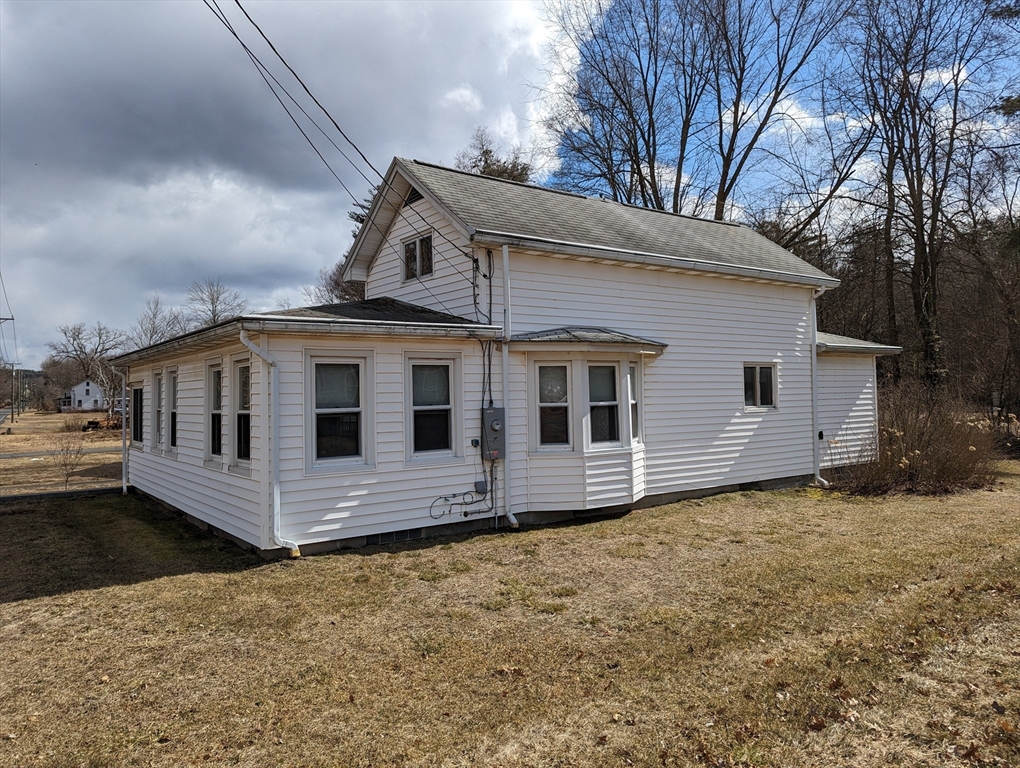 125 Plumtree Road Sunderland, MA 01375 - Photo 32 of 41 a front view of a house with a yard