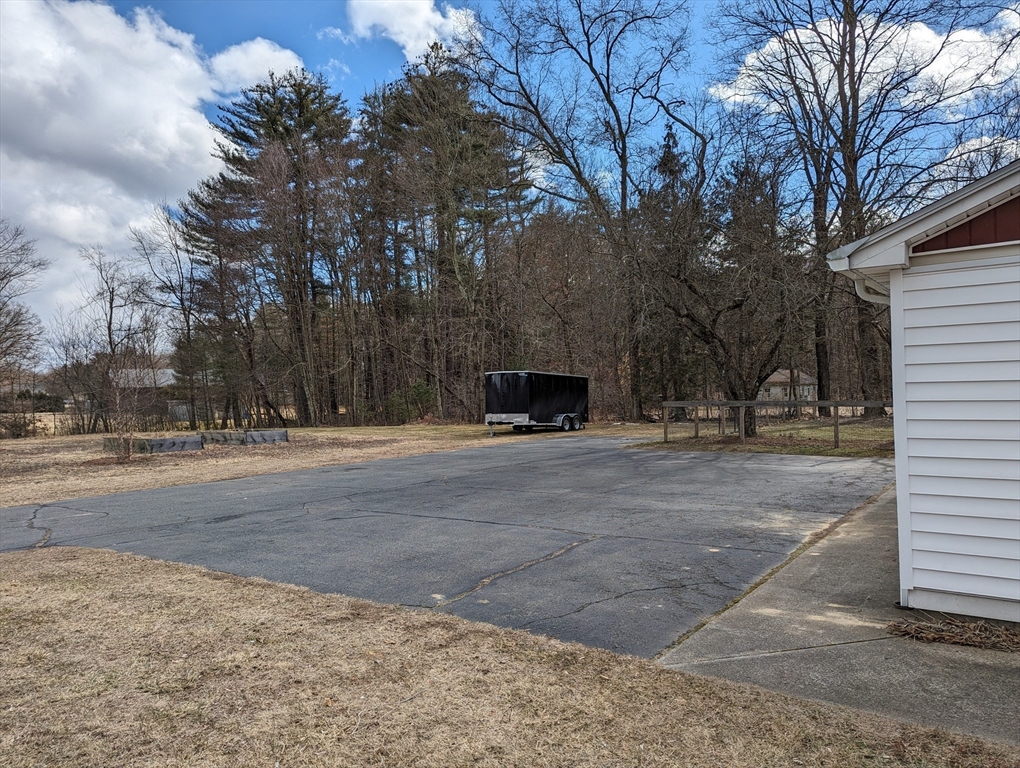 125 Plumtree Road Sunderland, MA 01375 - Photo 33 of 41 a front view of a house with a yard covered with snow