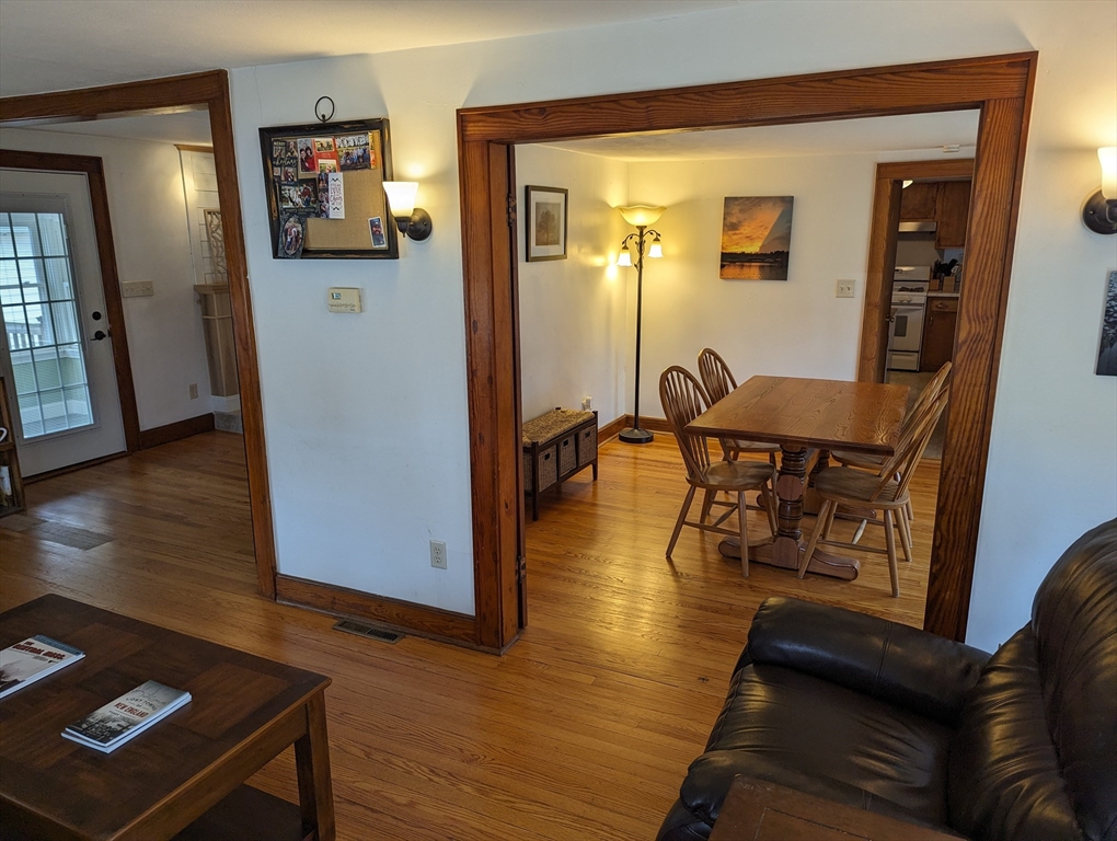 125 Plumtree Road Sunderland, MA 01375 - Photo 4 of 41 a view of a livingroom with furniture and hardwood floor