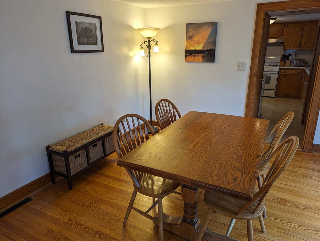 125 Plumtree Road Sunderland, MA 01375 - Photo 6 of 41 a bedroom with a bed and wooden floor