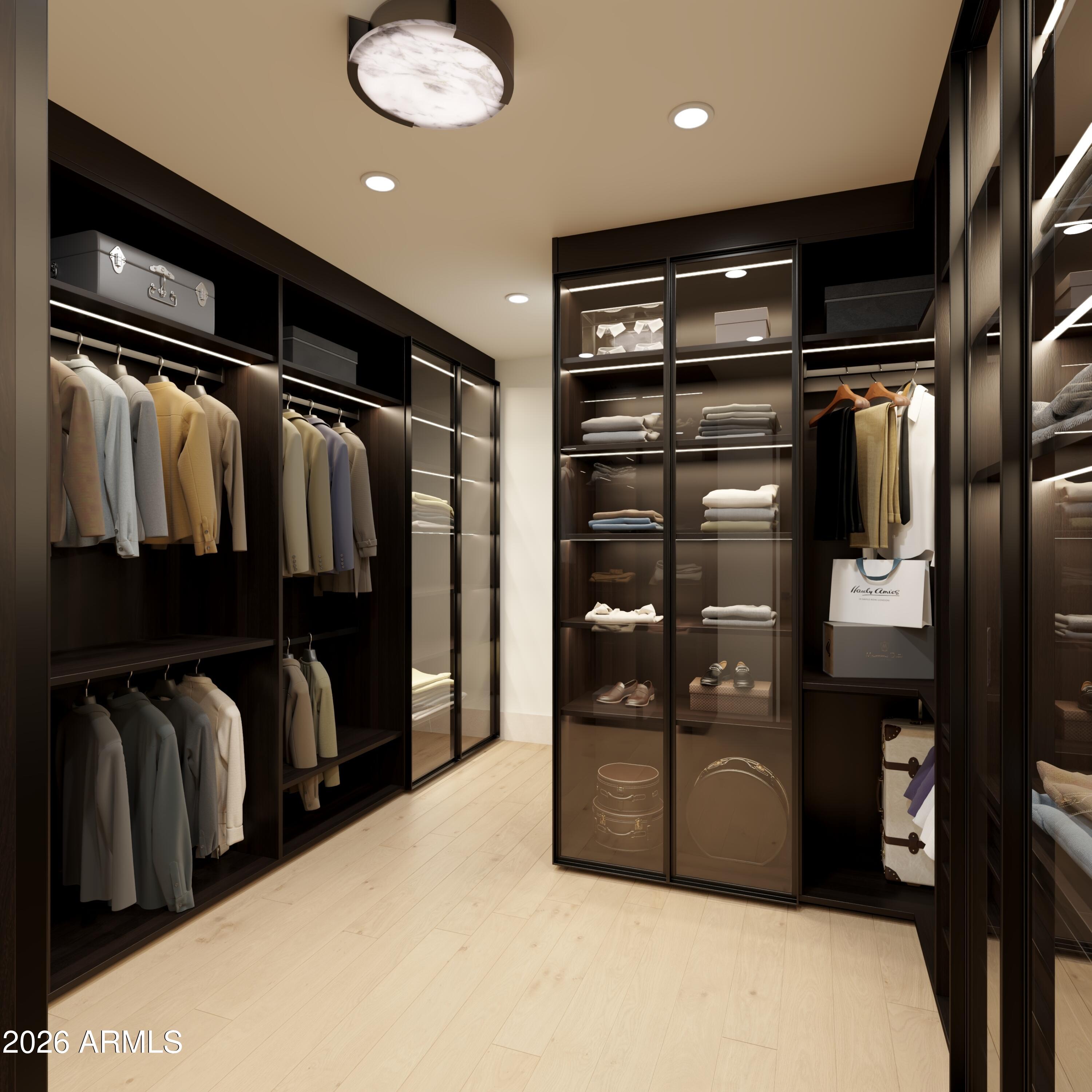 5009 East Roadrunner Road Paradise Valley, AZ 85253 - Photo 23 of 36 a view of walk in closet with clothes and shoes