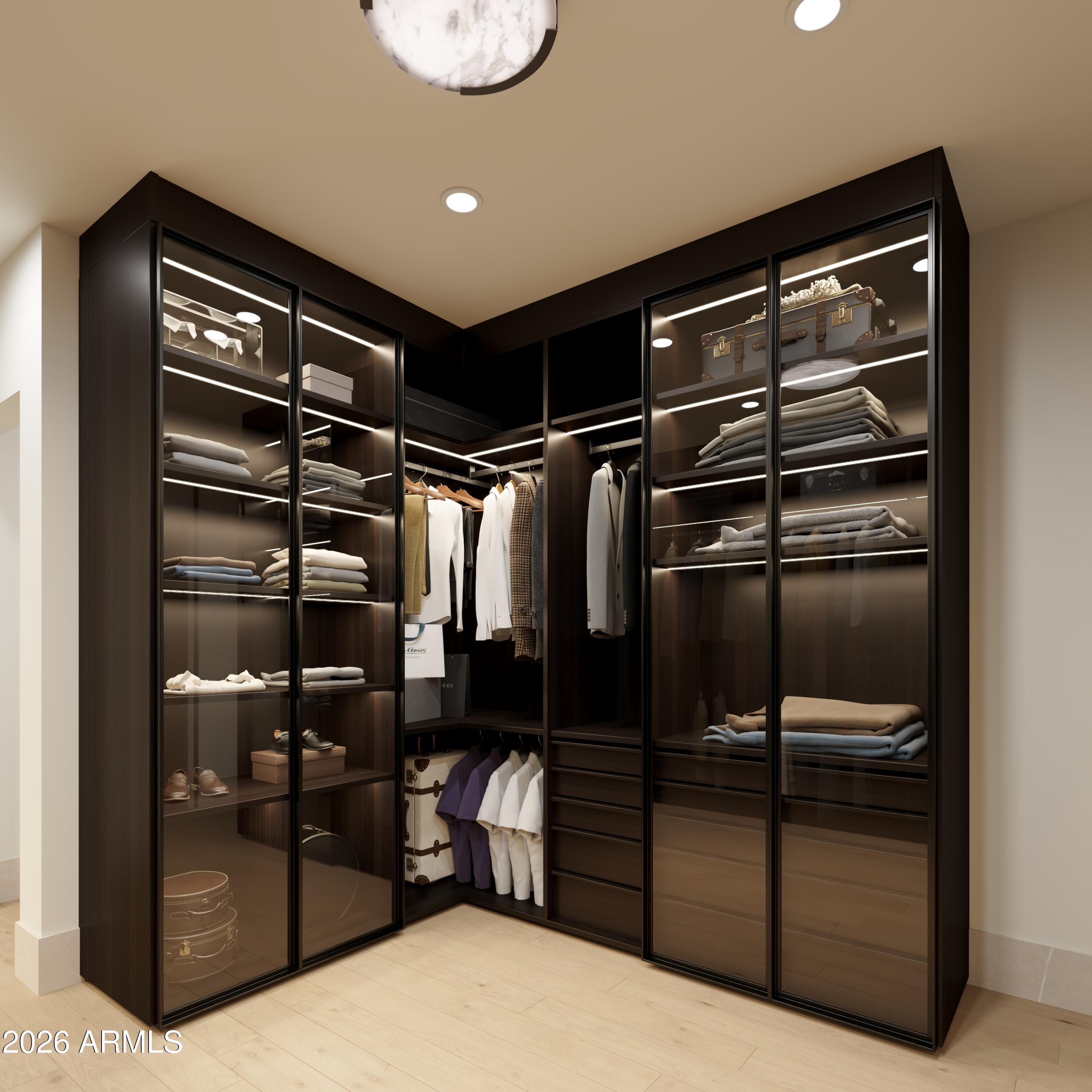5009 East Roadrunner Road Paradise Valley, AZ 85253 - Photo 25 of 36 a view of walk in closet with clothes and shoes