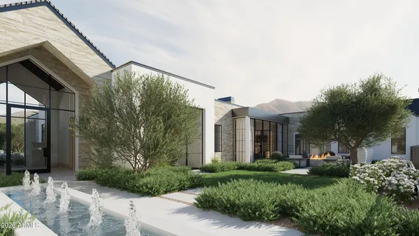 a view of a house with brick walls and a yard with plants