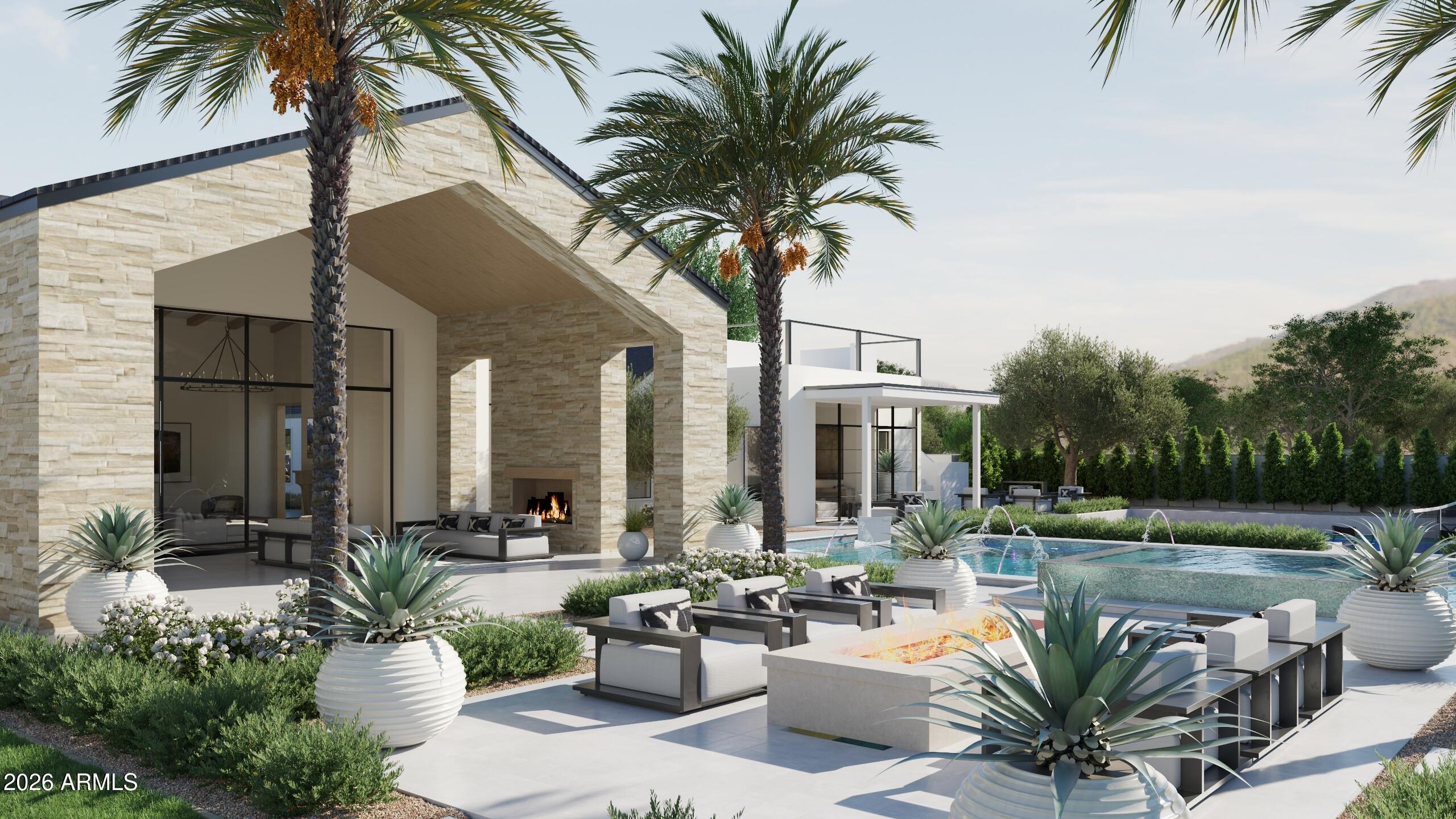 5009 East Roadrunner Road Paradise Valley, AZ 85253 - Photo 32 of 36 a view of a patio with couches table and chairs potted plants and palm tree