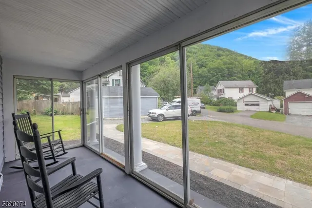 a view of a swimming pool with a porch