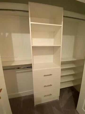 a view of a city with lush green forest