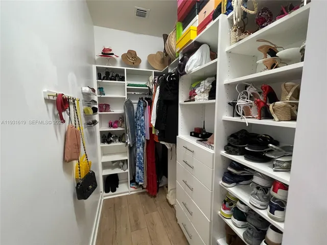a view of a porch with furniture and backyard