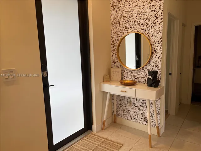 a living room with furniture and flower pot