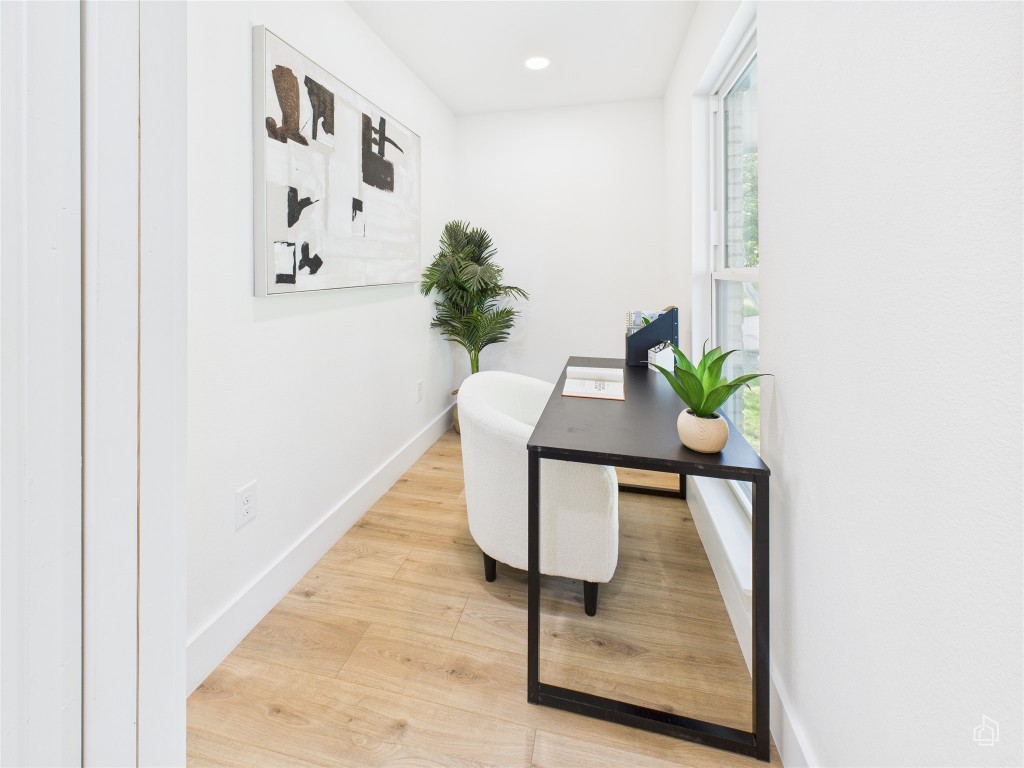 7019 Creighton Lane Austin, TX 78723 - Photo 13 of 40 a view of a hallway with a potted plant on a table