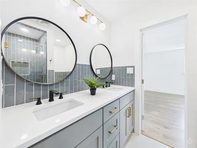 a bathroom with a sink and a mirror