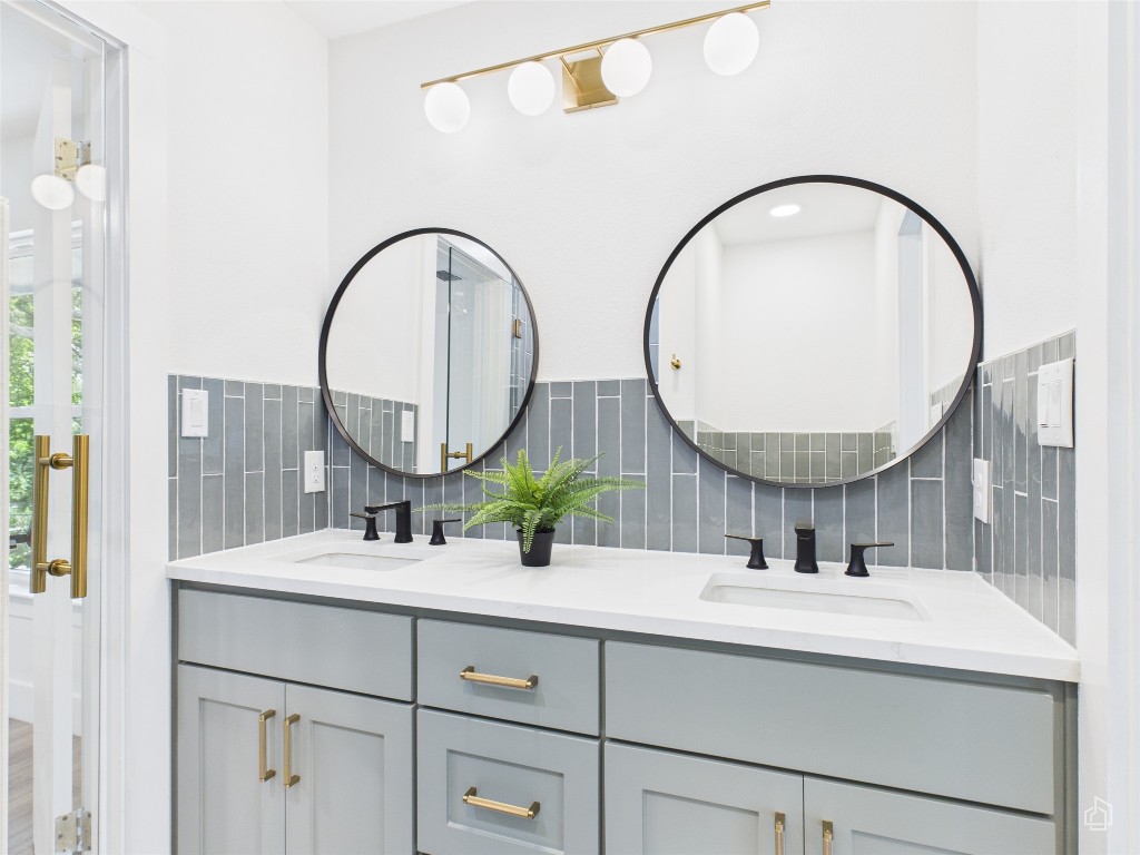 7019 Creighton Lane Austin, TX 78723 - Photo 30 of 40 a bathroom with a sink and a mirror