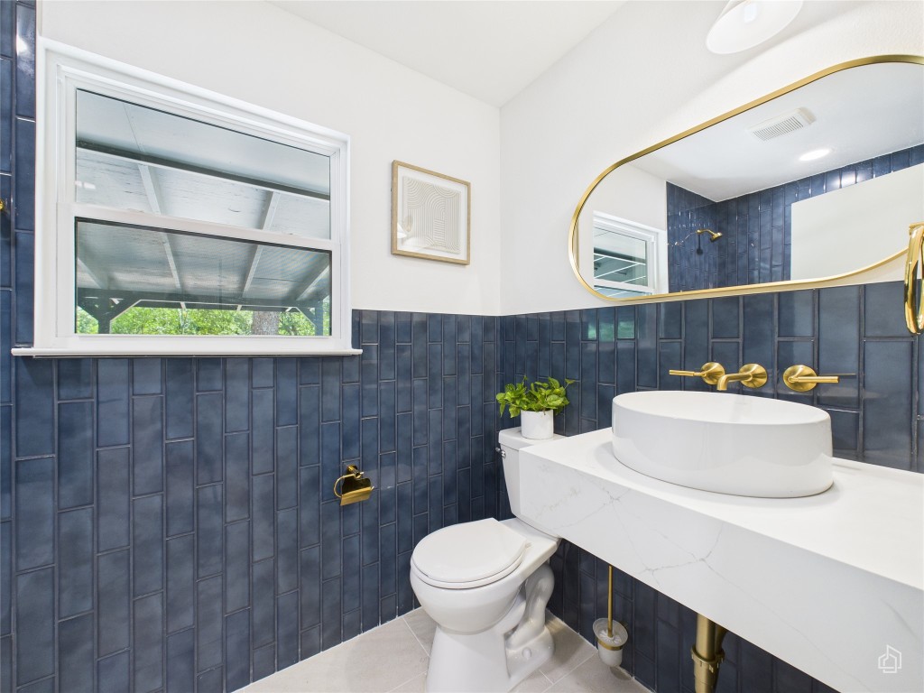 7019 Creighton Lane Austin, TX 78723 - Photo 32 of 40 a bathroom with a sink and a toilet