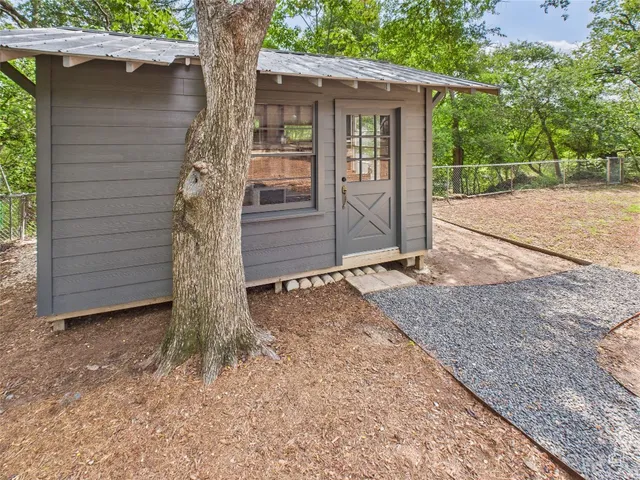 a view of a house with a tree