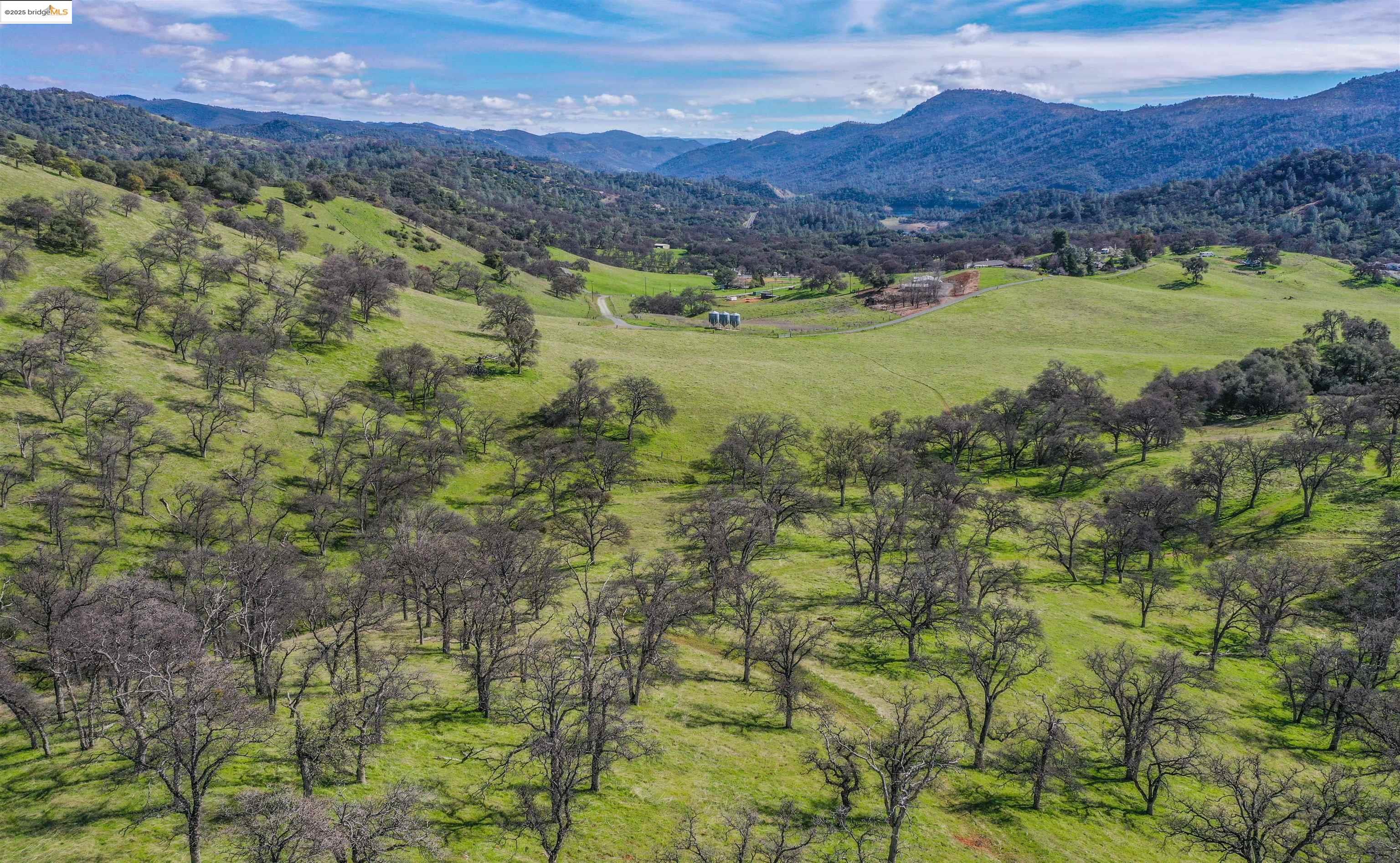 13300 Lone Bend Road Jamestown, CA 95327 - Photo 48 of 50 a view of a lush green hillside and houses