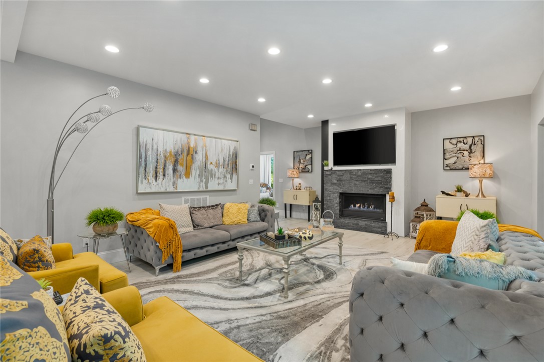 140 Turnberry Road Anderson, SC 29621 - Photo 8 of 44 This inviting living space features an elegant fireplace, offering comfort and style for everyday living.