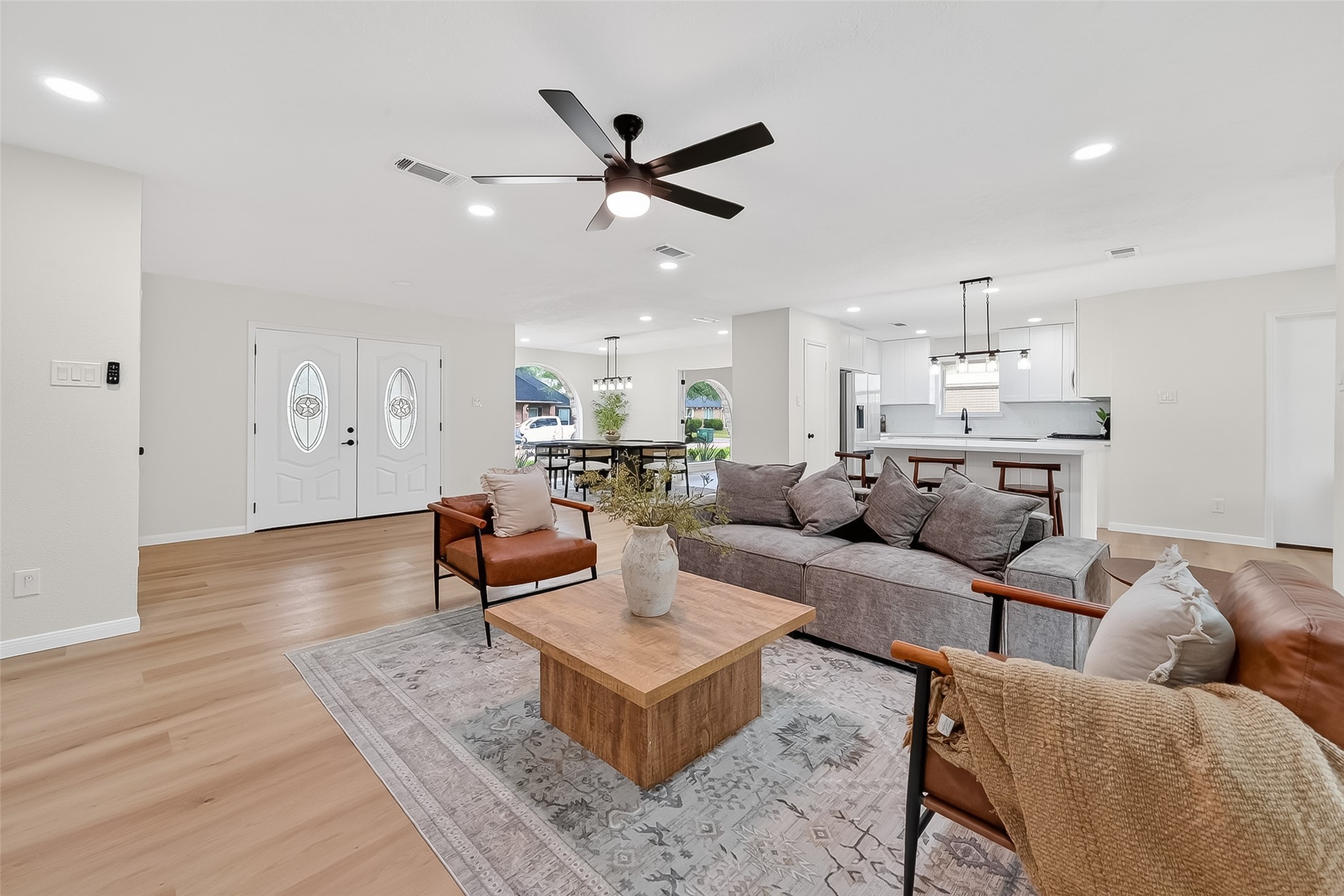 2914 Riata Lane Houston, TX 77043 - Photo 11 of 46 a living room with furniture and kitchen view