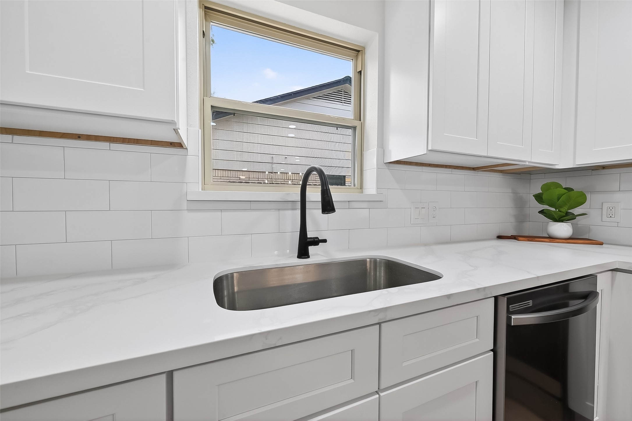 2914 Riata Lane Houston, TX 77043 - Photo 18 of 46 a kitchen with a sink and cabinets