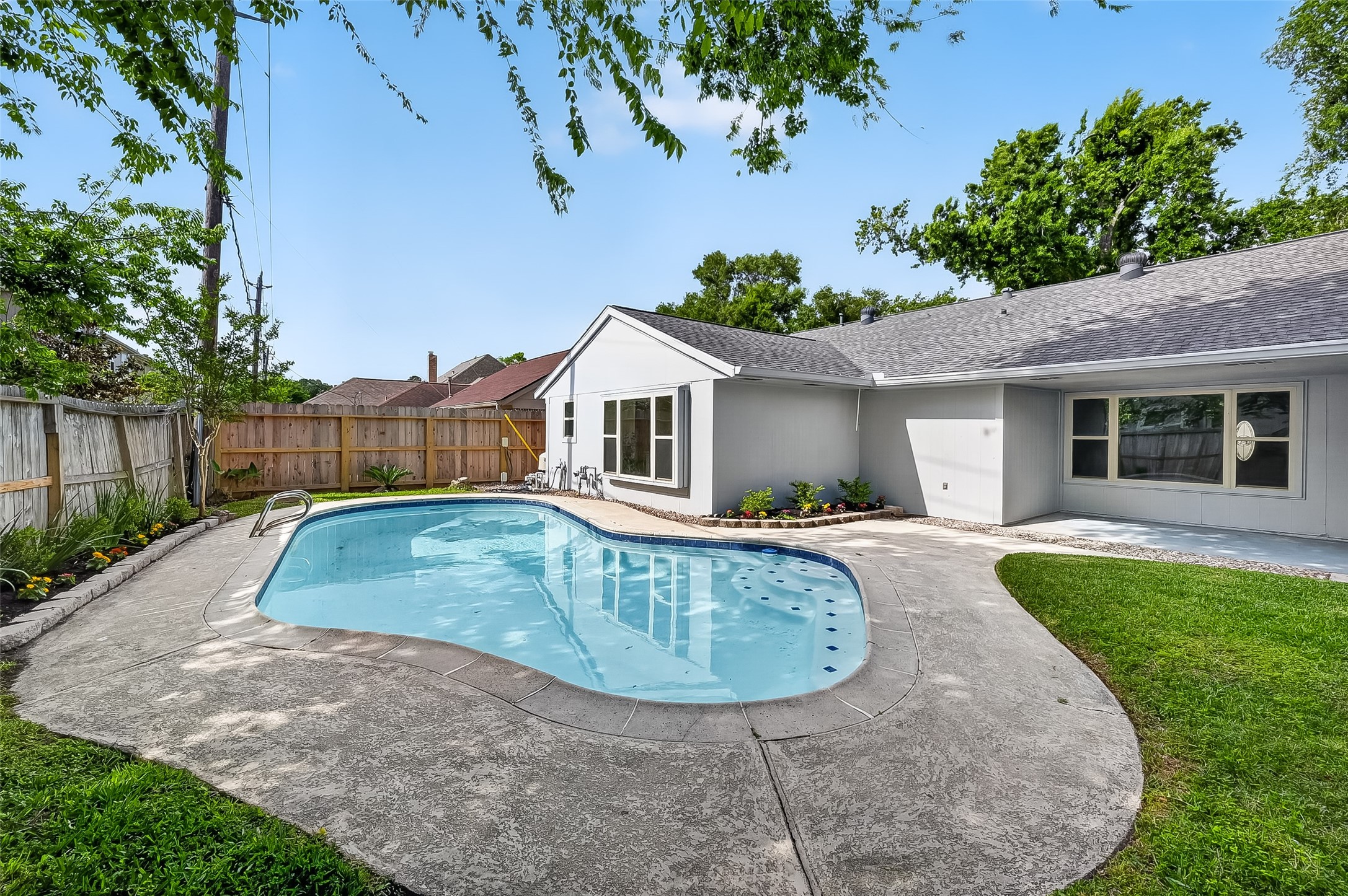 2914 Riata Lane Houston, TX 77043 - Photo 2 of 46 a view of a house with a yard plants and a small yard