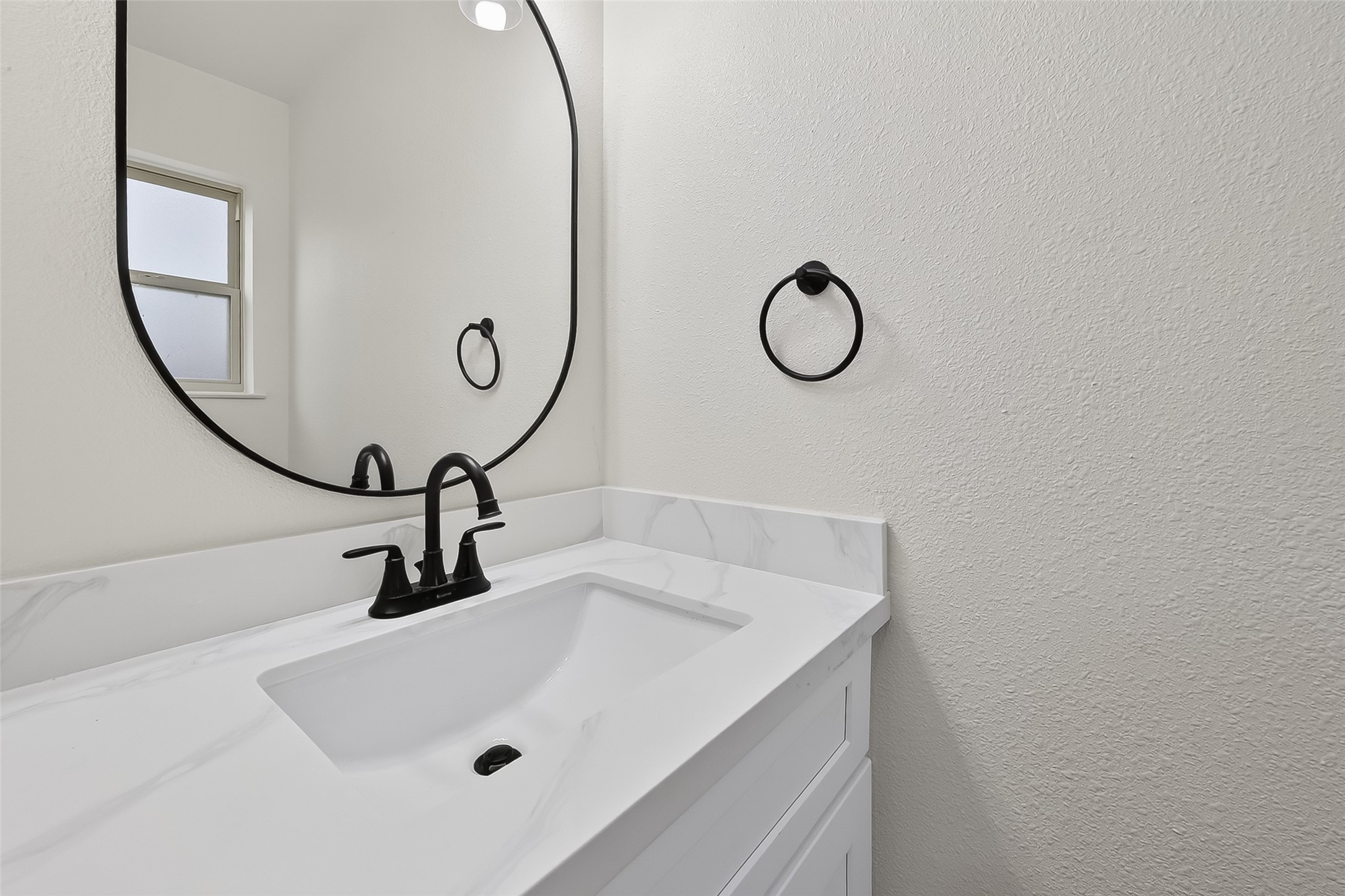 2914 Riata Lane Houston, TX 77043 - Photo 39 of 46 a bathroom with a sink and mirror