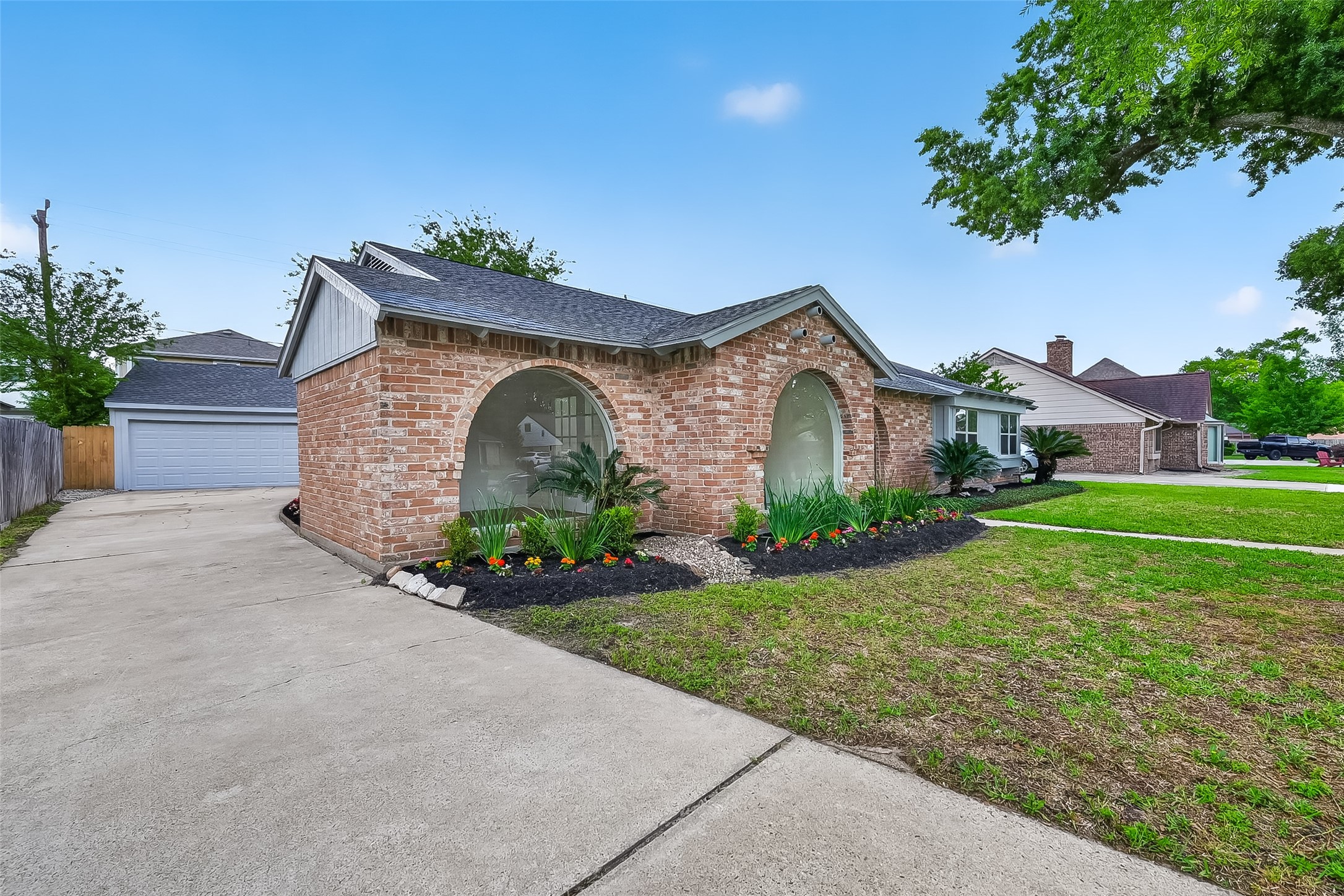 2914 Riata Lane Houston, TX 77043 - Photo 6 of 46 a front view of a house with garden