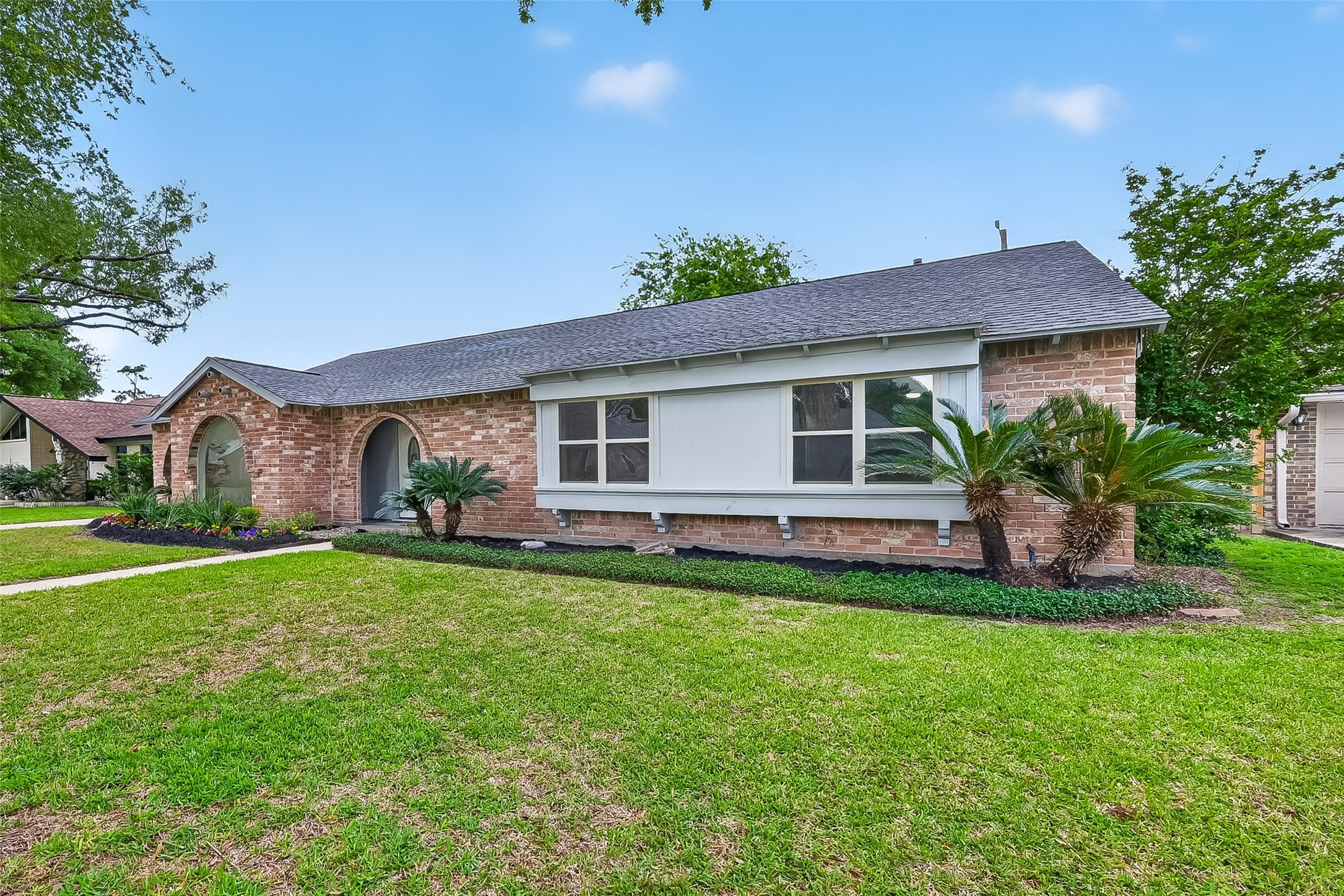 2914 Riata Lane Houston, TX 77043 - Photo 7 of 46 a front view of house with yard and green space