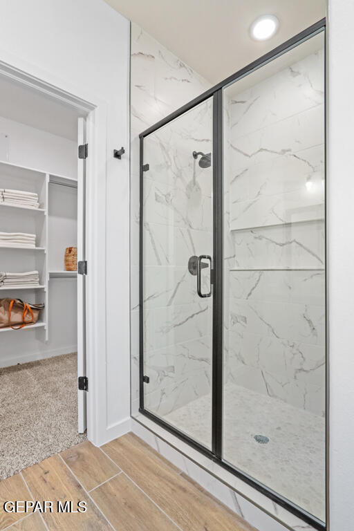 14952 Hill Ridge El Paso, TX 79938 - Photo 22 of 38 a bathroom with a glass shower door