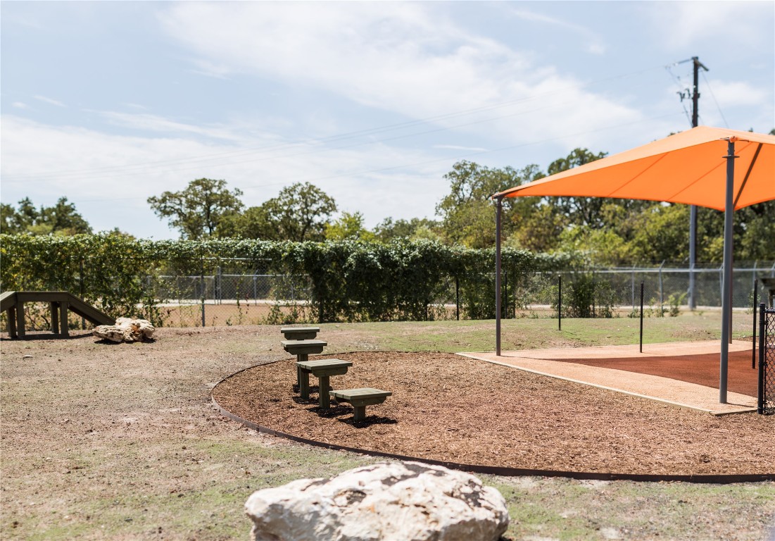 652 Los Olives Lane Georgetown, TX 78628 - Photo 28 of 36 a backyard of a house with lots of green space